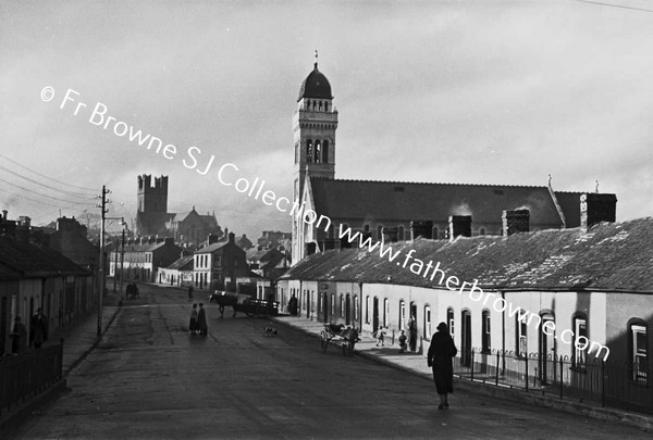 ROW OF COTTAGES WITH CHURCH